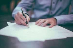 Shire Leasing Leasing Benefits Man Writing On Document